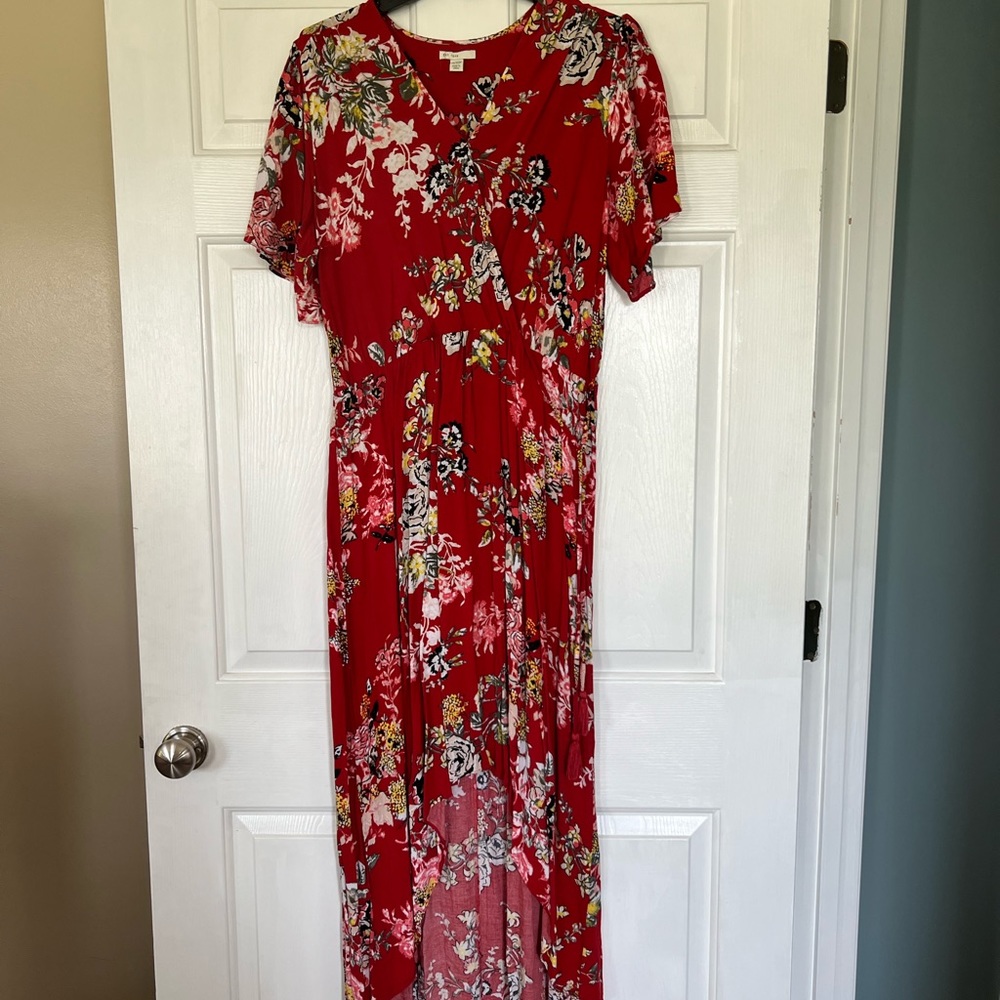 Red floral print dress with wrap bodice and tassel ties.